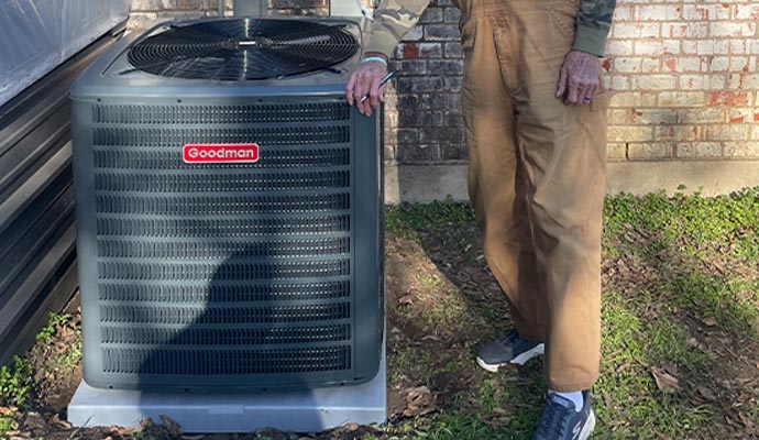 a person standing next to an installed ac