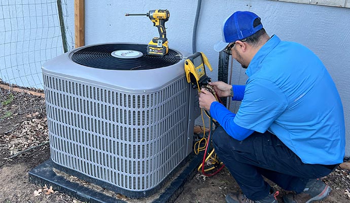 Expert inspecting heating system using equipment