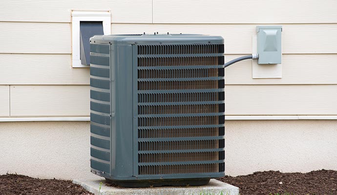 Installed heat pump with visible mold