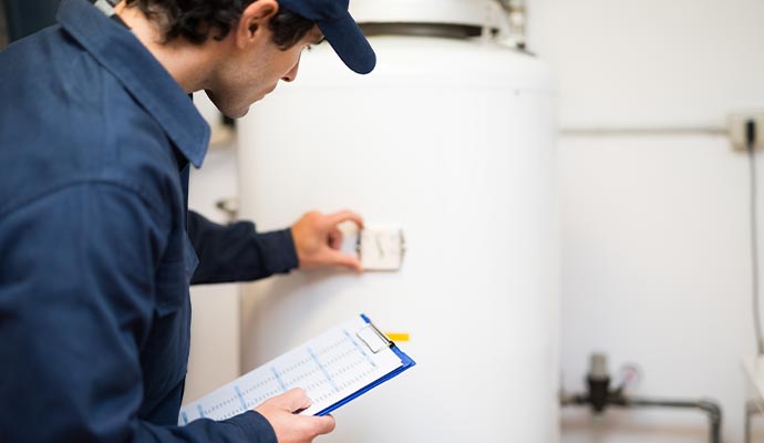 a professional inspecting a boiler