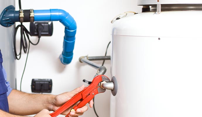 a professional performing maintenance on a boiler