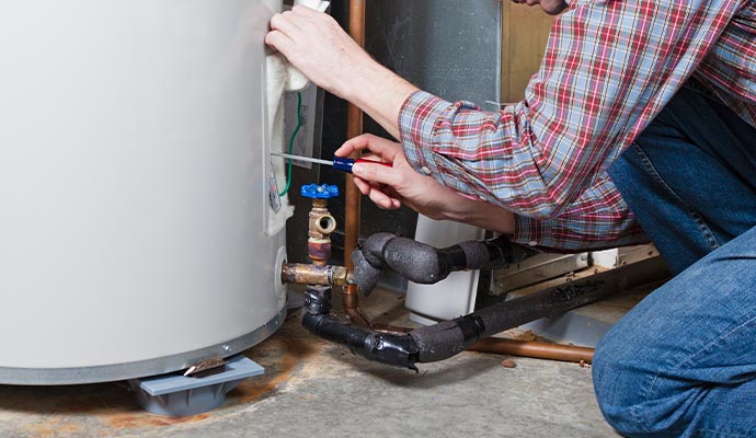 a professional servicing boiler parts