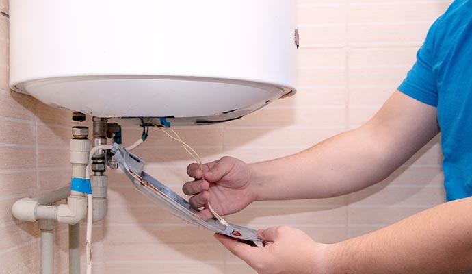 Expert installing a new boiler system