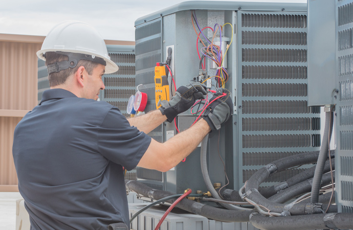 Expert fixing HVAC electrical issues.